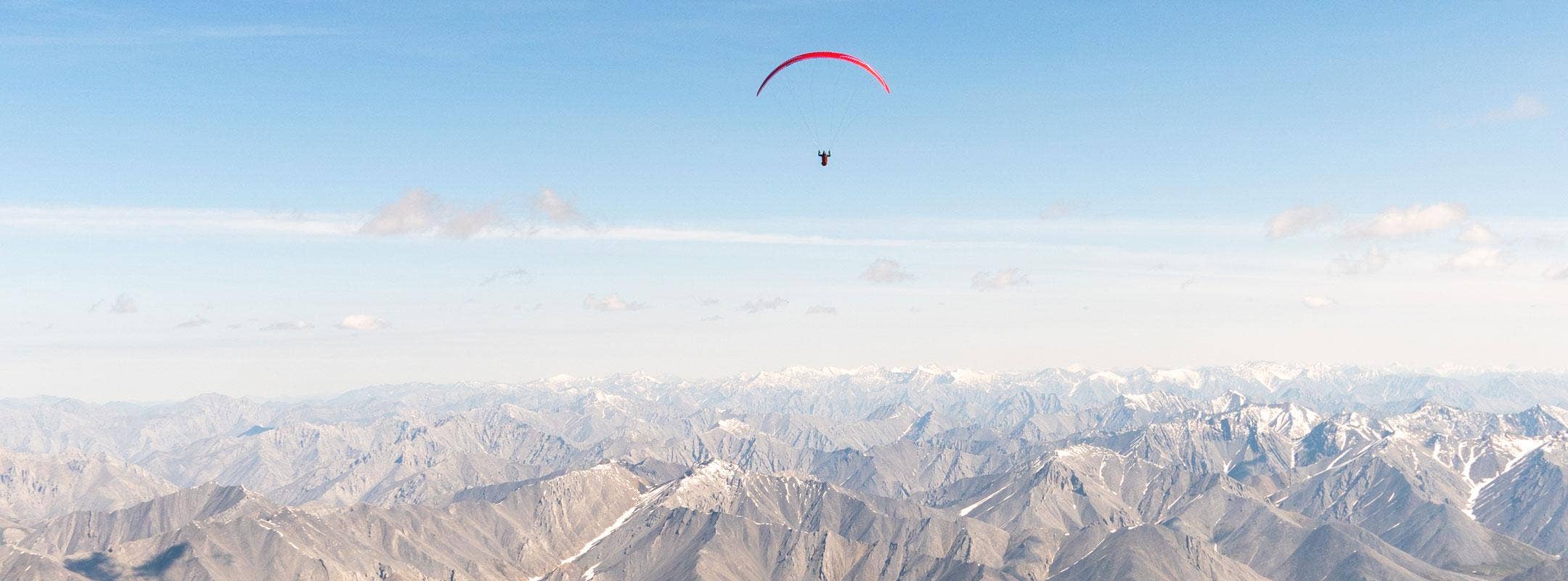 Paraglider above the mountains