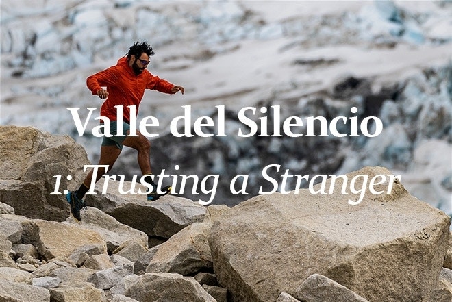 Felipe running and jumping across boulders in the Valle del Silencio, Patagonia, with a glacier in the background. 