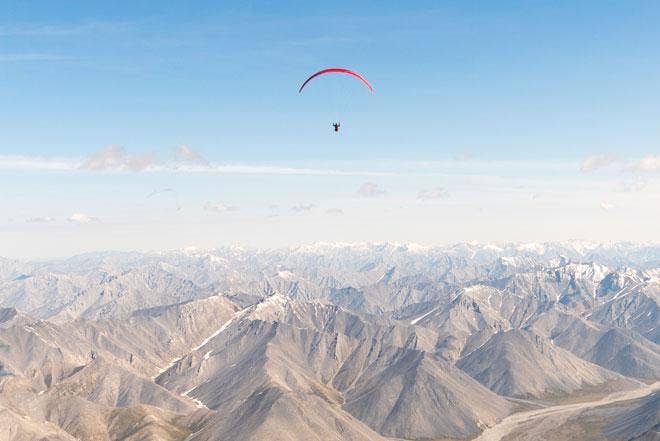 Paraglider above the mountains