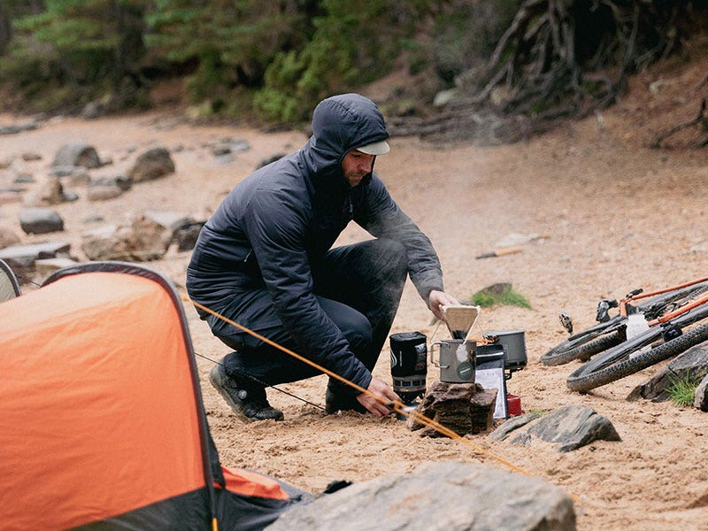 Hot drink being prepared on a stove at camp