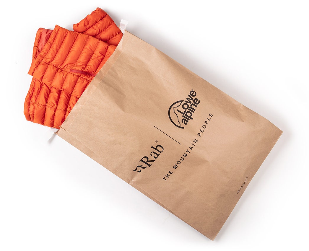 Rab jacket packed in a recycled paper bag