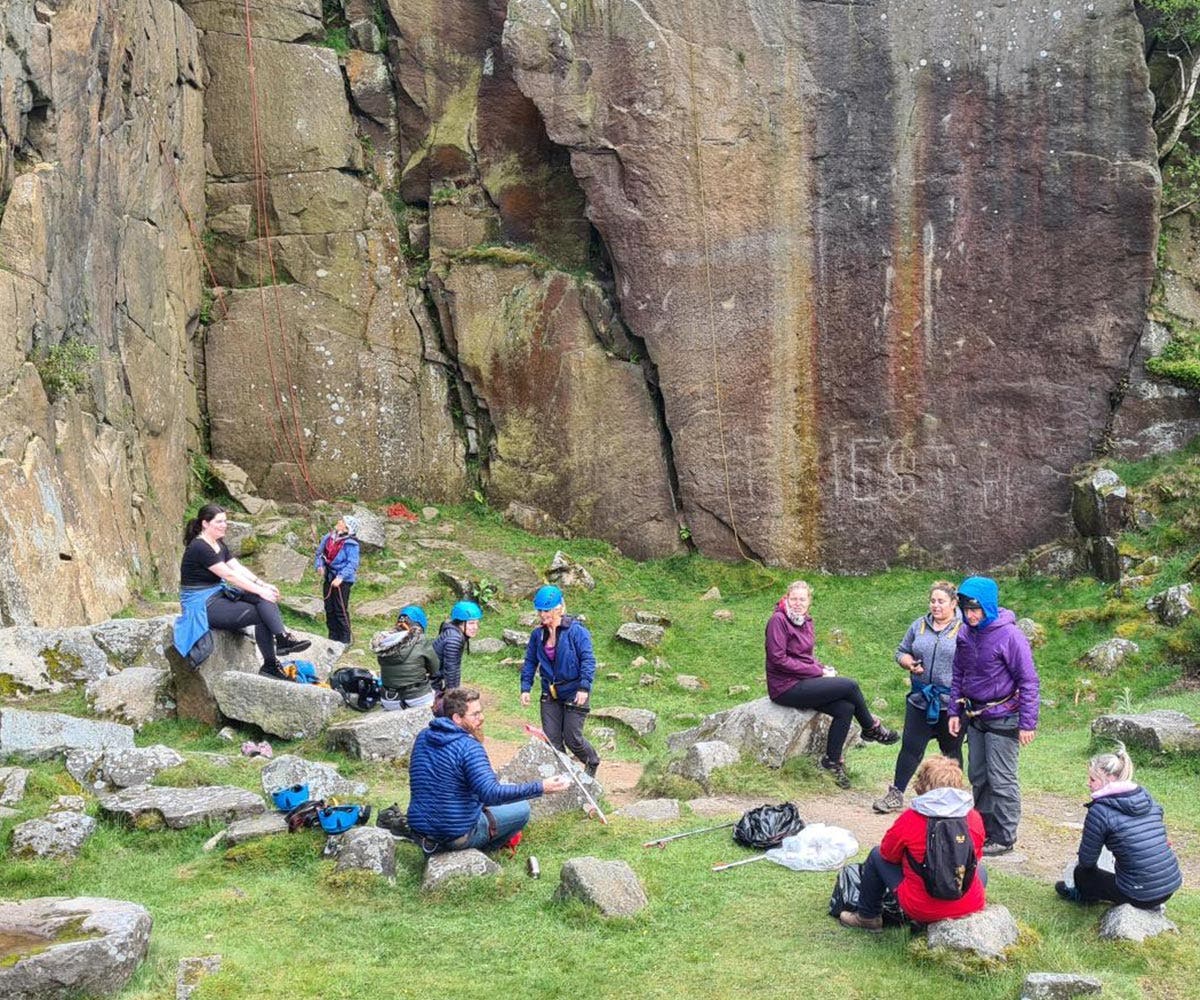 Rab employees learning climbing, whilst clearing little from the peak district